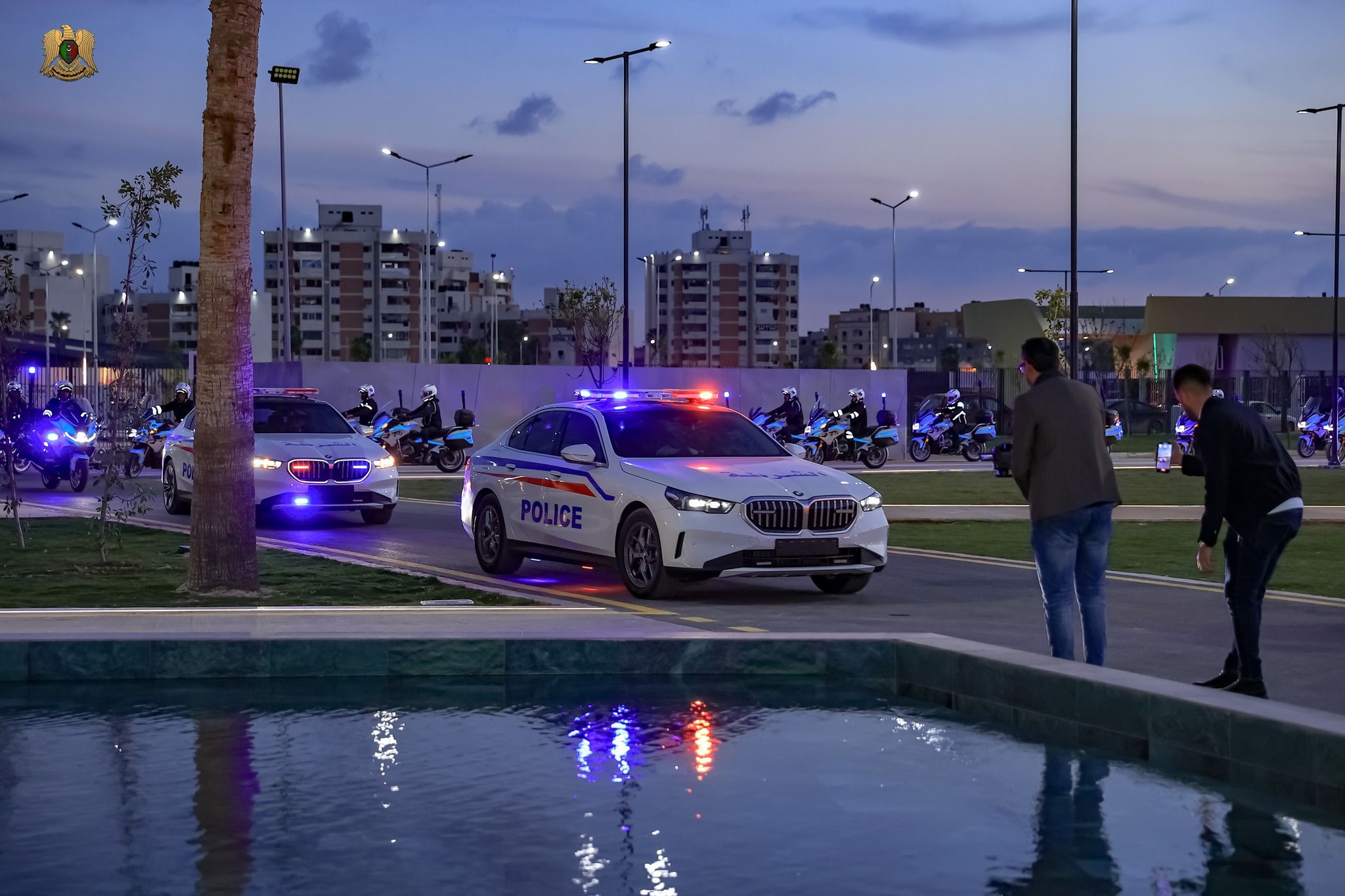 May be an image of 6 people, lighting, car, street and text