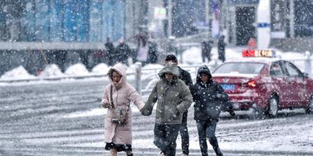 صور| الجليد يكسو شوارع مدن صينية بعد تحذير من عواصف شديدة - عرب فايف